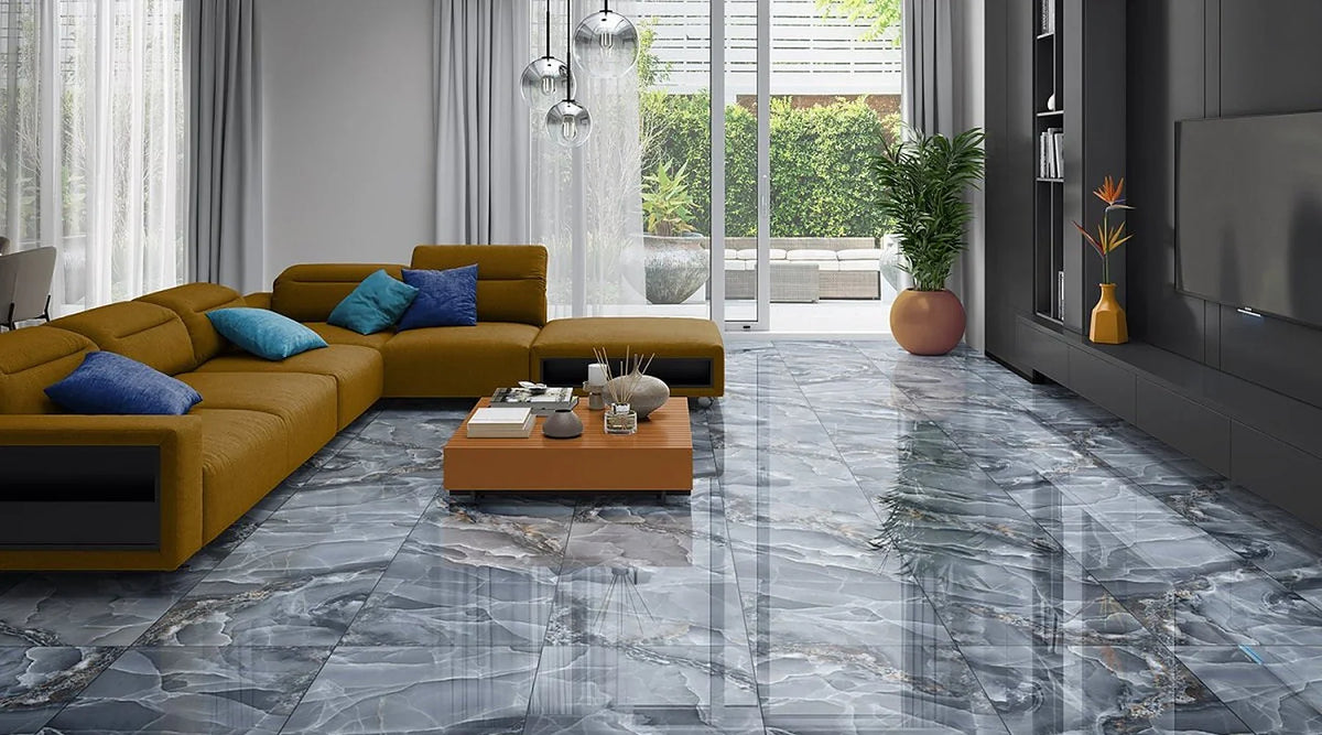 Onyx Blue marble effect polished porcelain floor in an open-plan living room with a mustard sofa and garden doors
