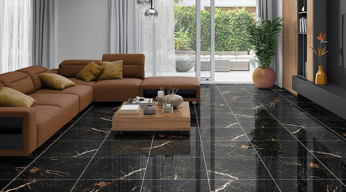 Sky Golden Black marble effect polished porcelain floor with gold veins in a living room with a tan sofa and garden doors
