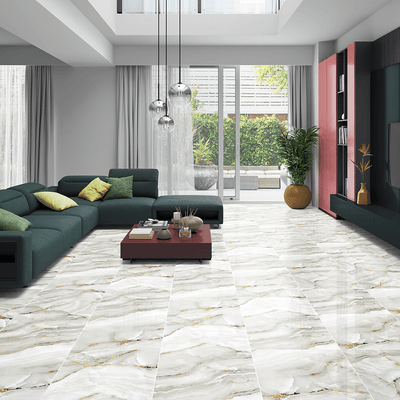 Spacious living room styled with Aurora Onyx Gold Glossy Porcelain Tiles 60x60cm adding luxury and bright reflection.