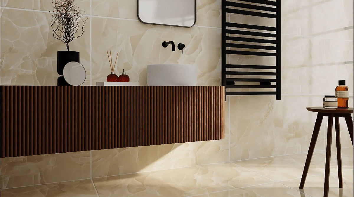 Onyx Cream marble effect polished porcelain on bathroom walls and floor with a fluted walnut vanity and black towel radiator