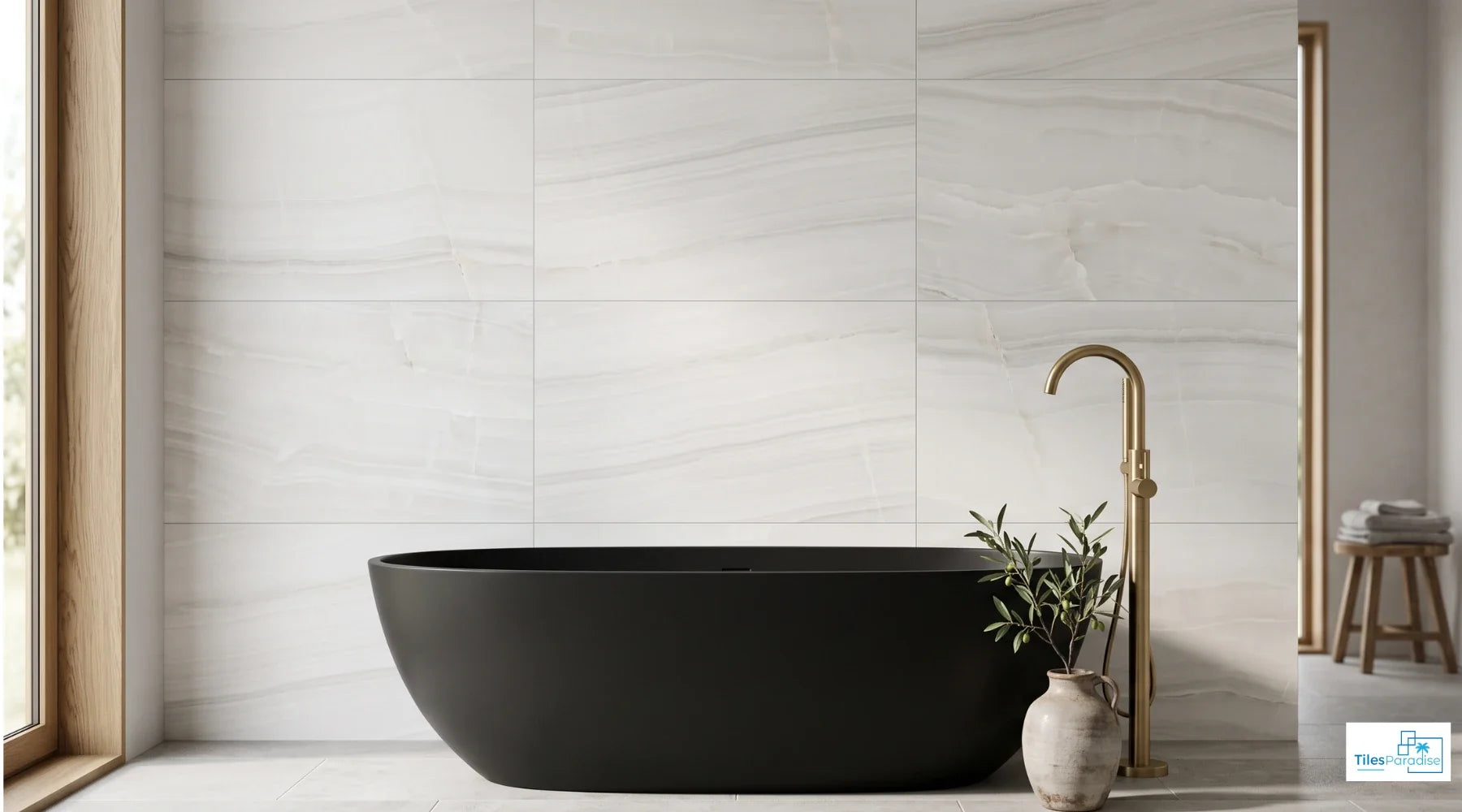 Rossato Bianco onyx effect matt porcelain 60x120cm tiles installed on a bathroom feature wall behind a freestanding bath