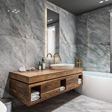 Modern bathroom with grey marble bathroom tiles on walls and floor, wooden vanity and stylish basin