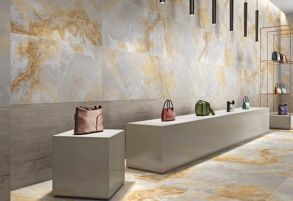 Modern kitchen interior with beige kitchen tiles on walls and floor showing smooth marble design.