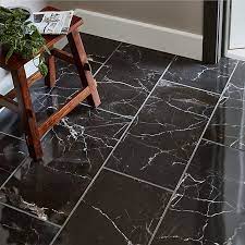 Stylish black tiles with marble effect for modern floor design in kitchen or living room