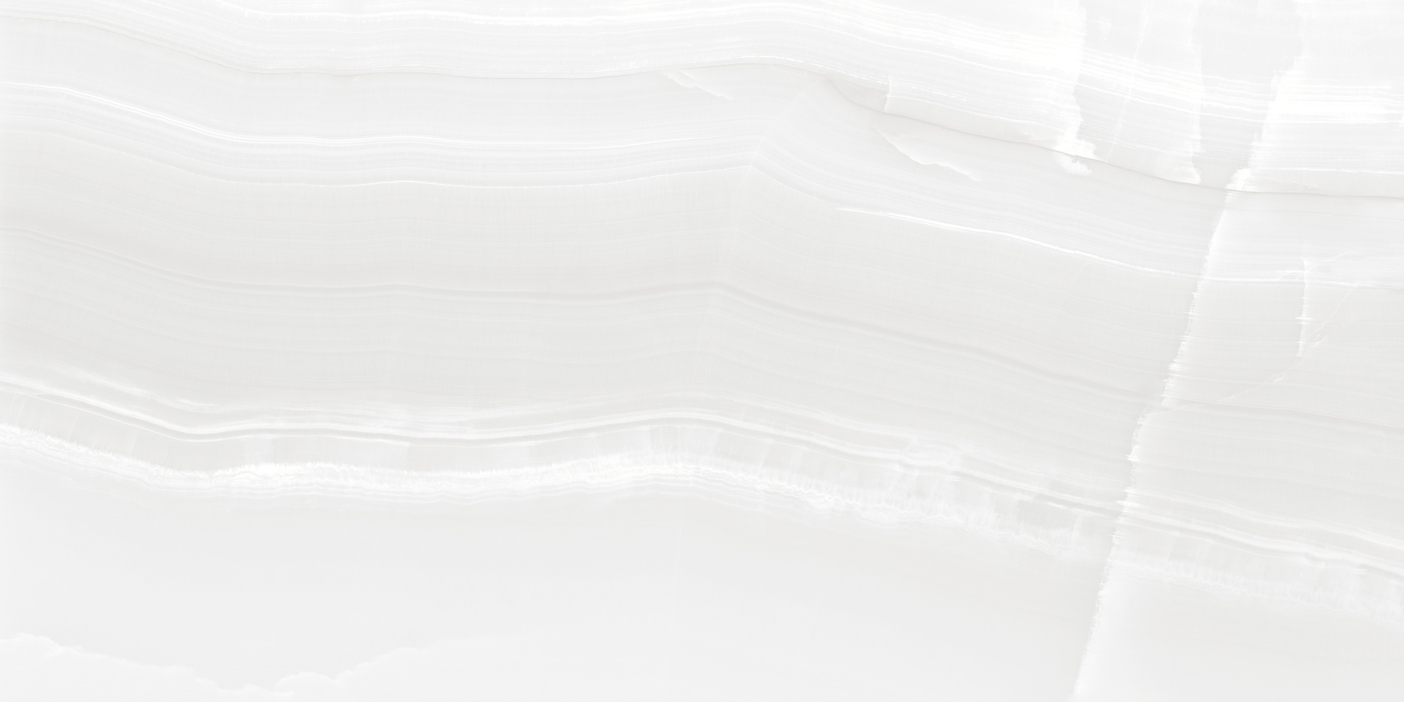 White onyx effect porcelain tile close up showing translucent wave banding polished finish 60x120cm