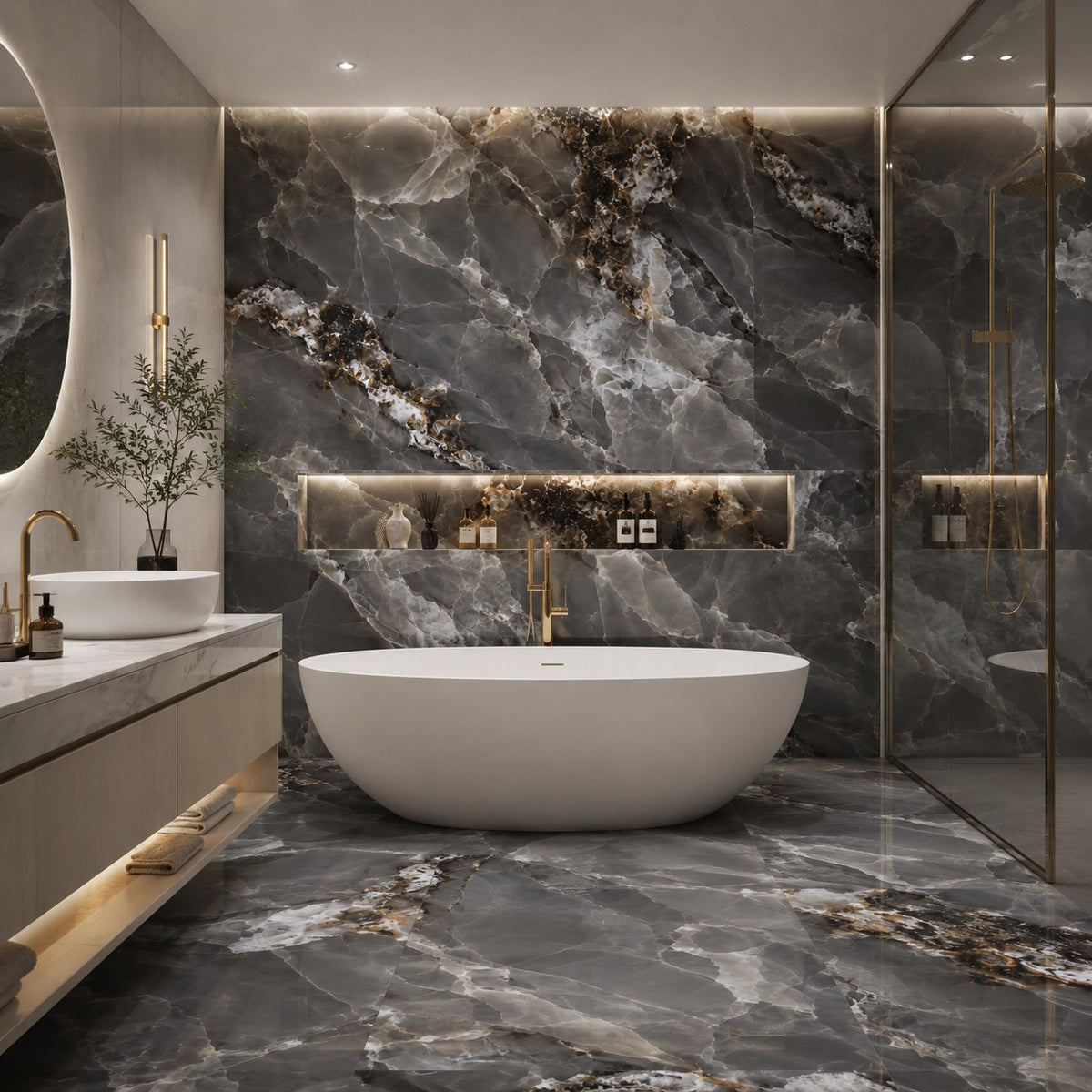 A luxury modern bathroom featuring a freestanding oval white bathtub in front of a large dark gray marble wall with gold veining, matching marble flooring, a floating vanity with a white vessel sink, and a glass shower enclosure.