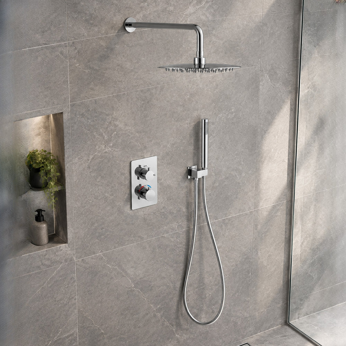 Orbis chrome concealed shower set with round rainfall head and pencil handset on grey stone-effect tiles